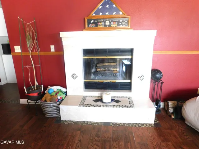 a room with furniture and wooden floor