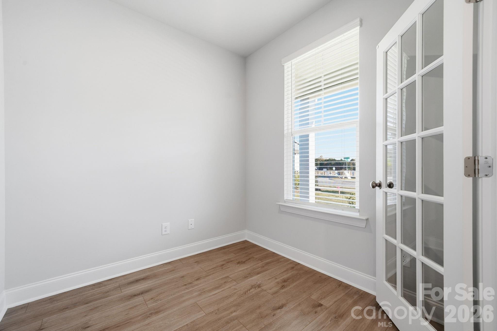 1827 Viewfield Road Fort Mill, SC 29708 - Photo 24 of 43 a view of empty room with wooden floor and fan