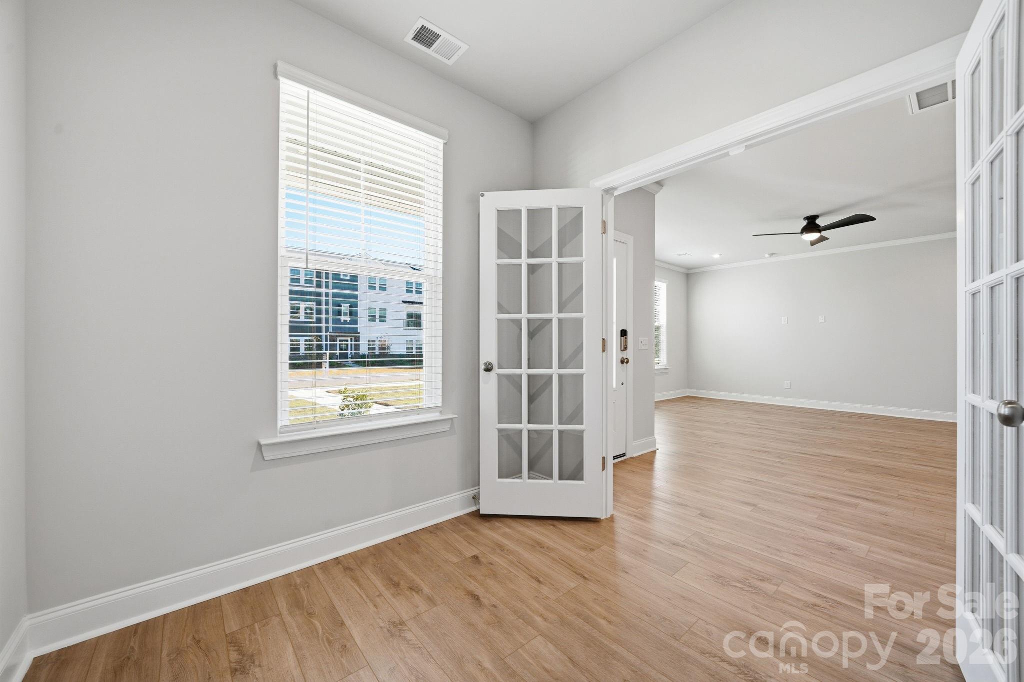 1827 Viewfield Road Fort Mill, SC 29708 - Photo 25 of 43 an empty room with wooden floor and windows