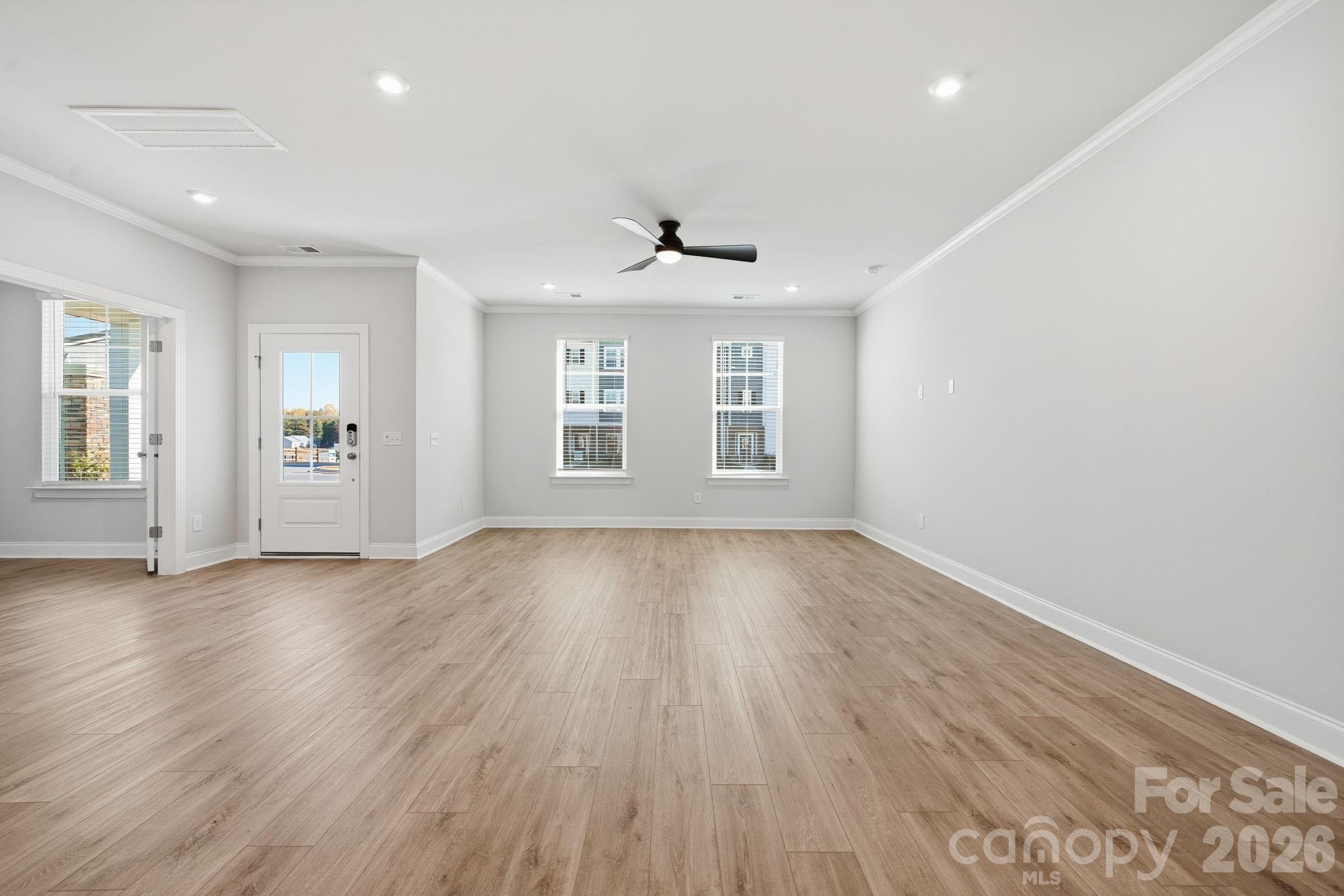1827 Viewfield Road Fort Mill, SC 29708 - Photo 31 of 43 an empty room with wooden floor and windows