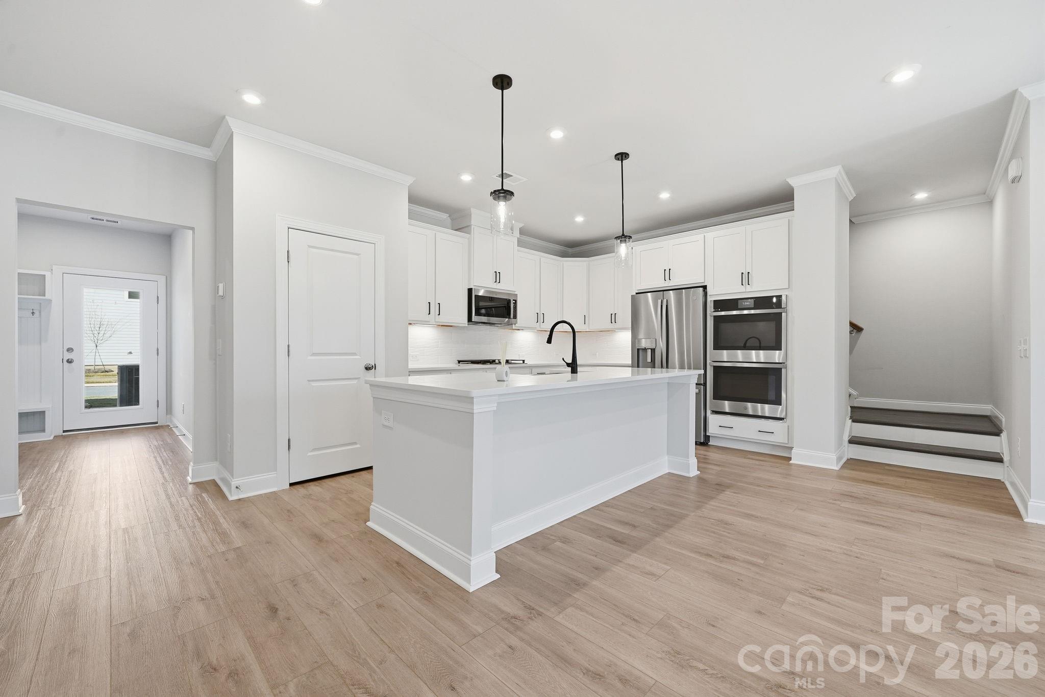 1827 Viewfield Road Fort Mill, SC 29708 - Photo 9 of 43 a view of kitchen with wooden floor and window