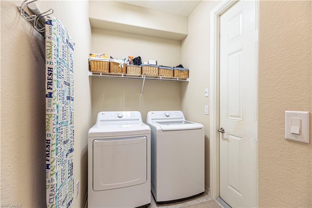 9063 Capistrano Street North, Unit 4405 Naples, FL 34113 - Photo 16 of 37 a utility room with dryer and washer