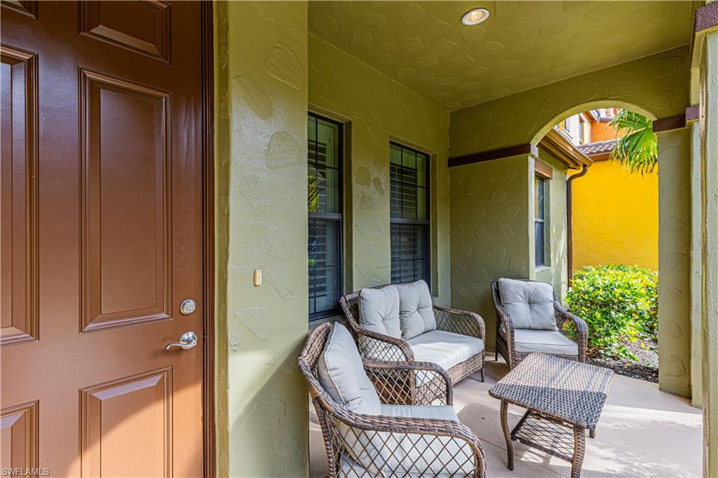 9063 Capistrano Street North, Unit 4405 Naples, FL 34113 - Photo 3 of 37 a view of balcony with furniture and a potted plant