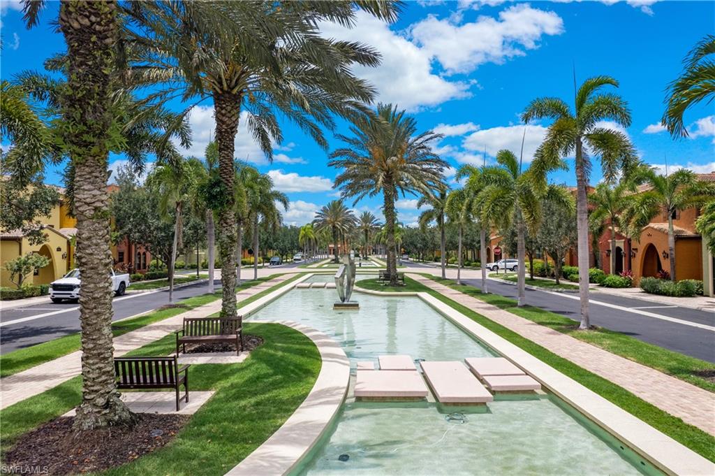 9063 Capistrano Street North, Unit 4405 Naples, FL 34113 - Photo 36 of 37 a view of a backyard with swimming pool