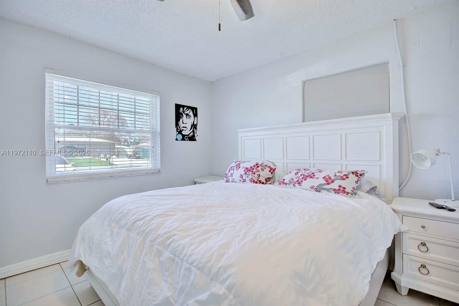 4131 Bianca Street Sebring, FL 33872 - Photo 16 of 30 a bedroom with a bed and a window
