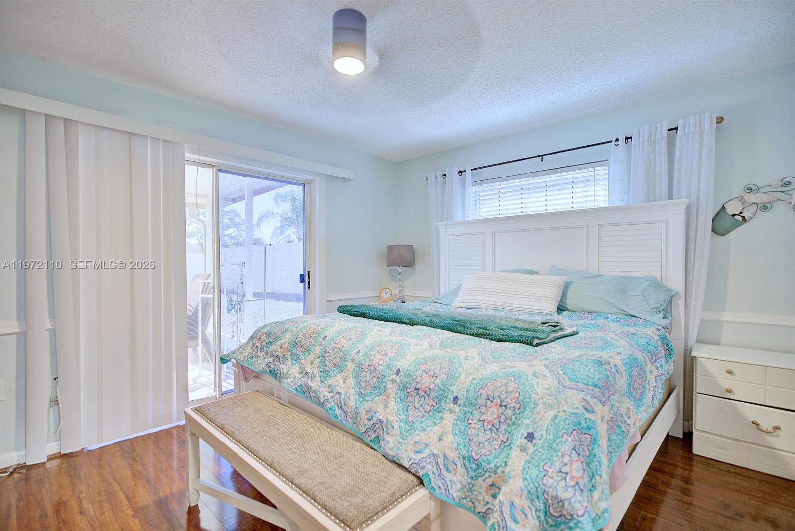 4131 Bianca Street Sebring, FL 33872 - Photo 21 of 30 a bedroom with a bed and a table