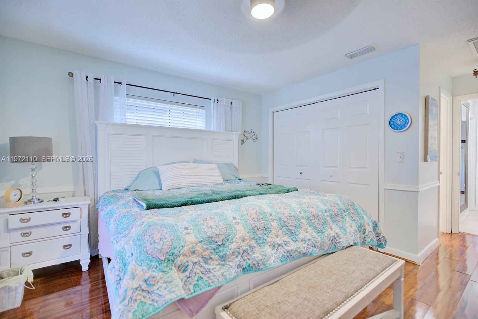 4131 Bianca Street Sebring, FL 33872 - Photo 23 of 30 a bedroom with a bed and a cabinets