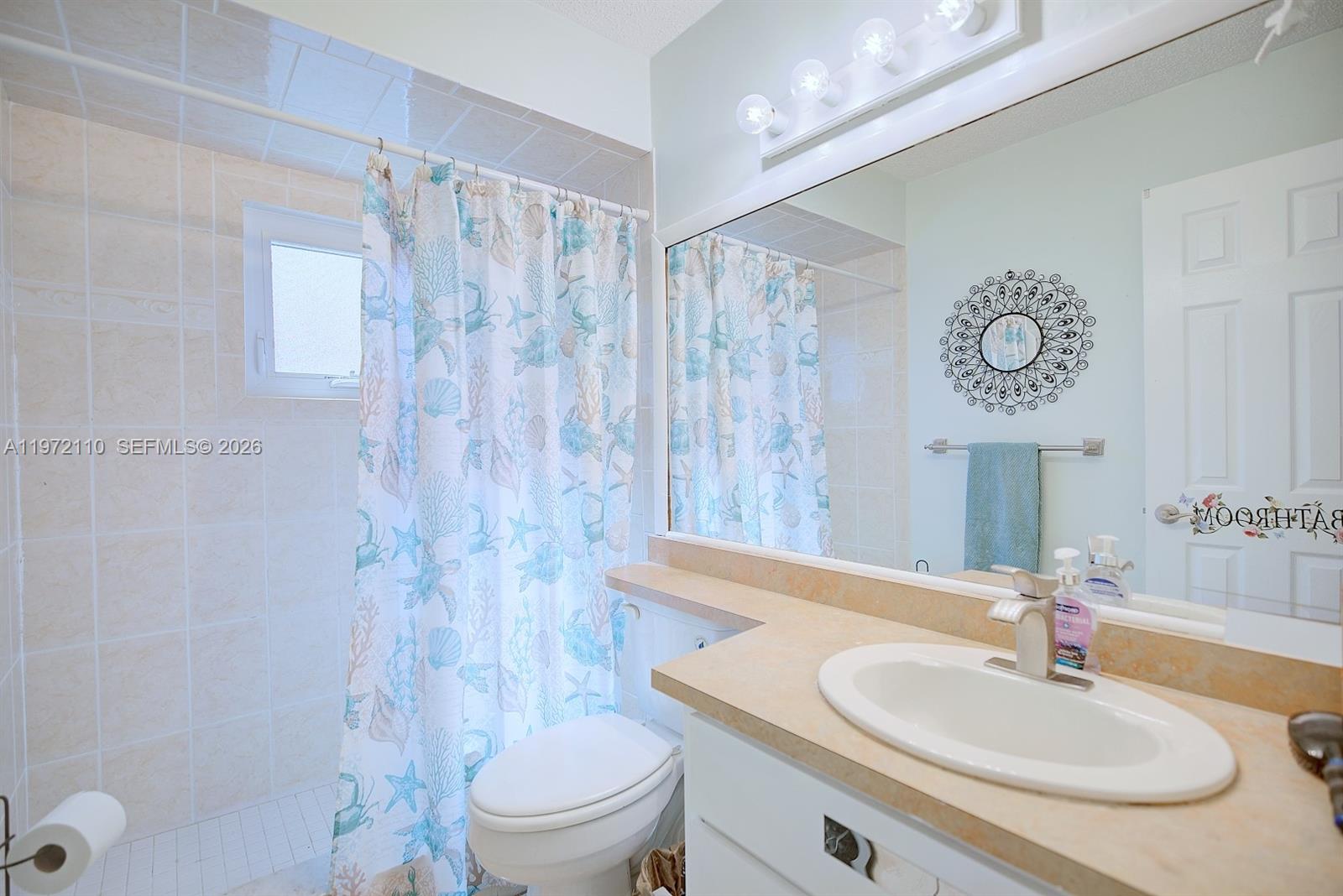 4131 Bianca Street Sebring, FL 33872 - Photo 24 of 30 a bathroom with a sink toilet and shower