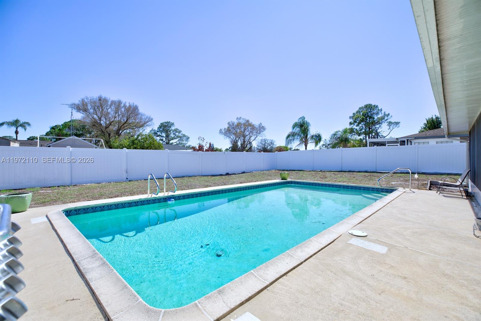 4131 Bianca Street Sebring, FL 33872 - Photo 27 of 30 swimming pool with outdoor seating and yard in the back