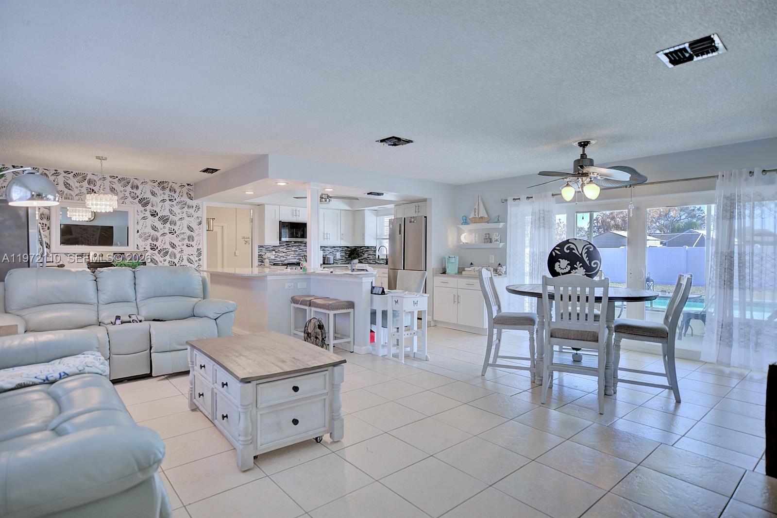 4131 Bianca Street Sebring, FL 33872 - Photo 3 of 30 a living room with furniture and view of kitchen