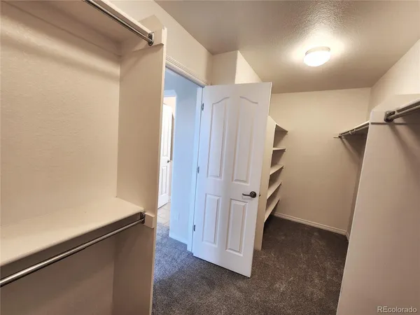 a view of a hallway with closet