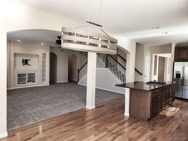 a view of living room with furniture and wooden floor