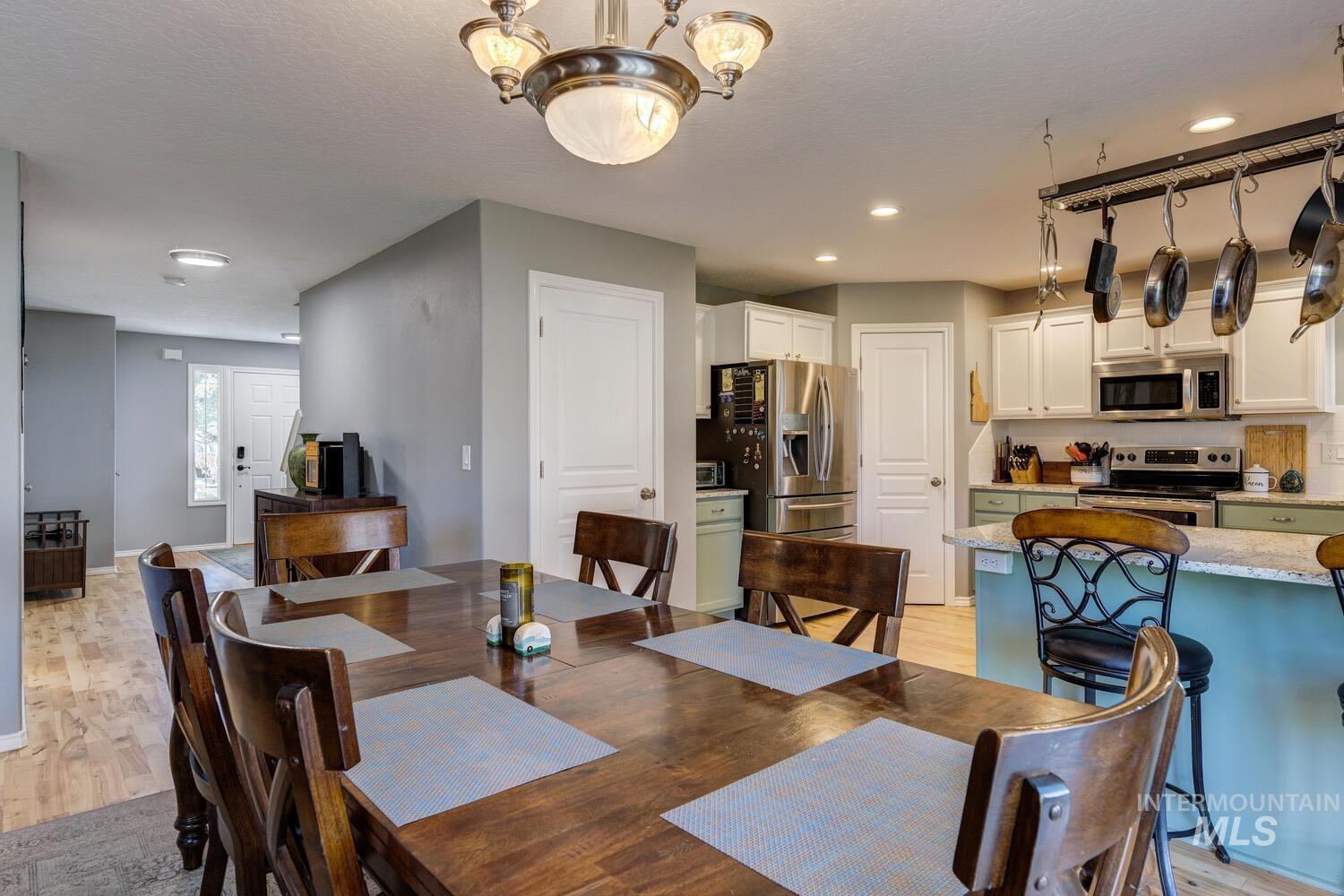 4428 West Campfire Street Meridian, ID 83646 - Photo 19 of 46 Dining room featuring light wood finished floors, recessed lighting, and a chandelier