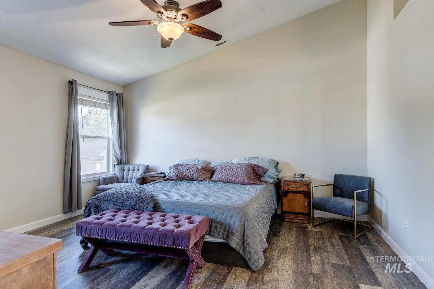 4428 West Campfire Street Meridian, ID 83646 - Photo 26 of 46 Bedroom with dark wood-style flooring and a ceiling fan