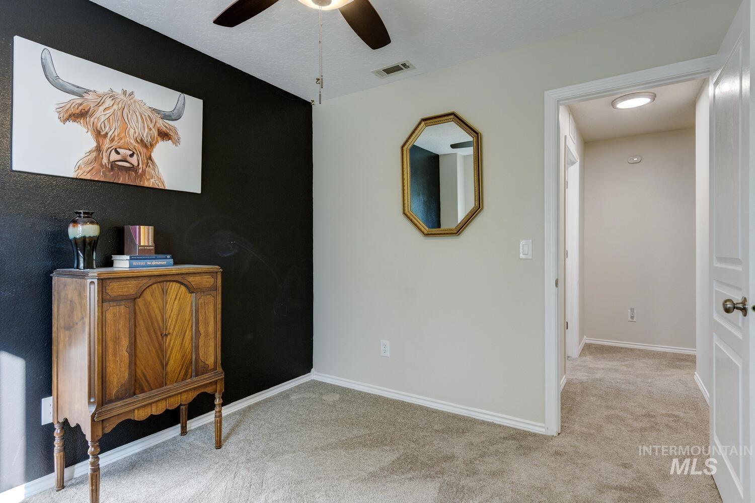 4428 West Campfire Street Meridian, ID 83646 - Photo 34 of 46 Carpeted bedroom featuring baseboards and ceiling fan