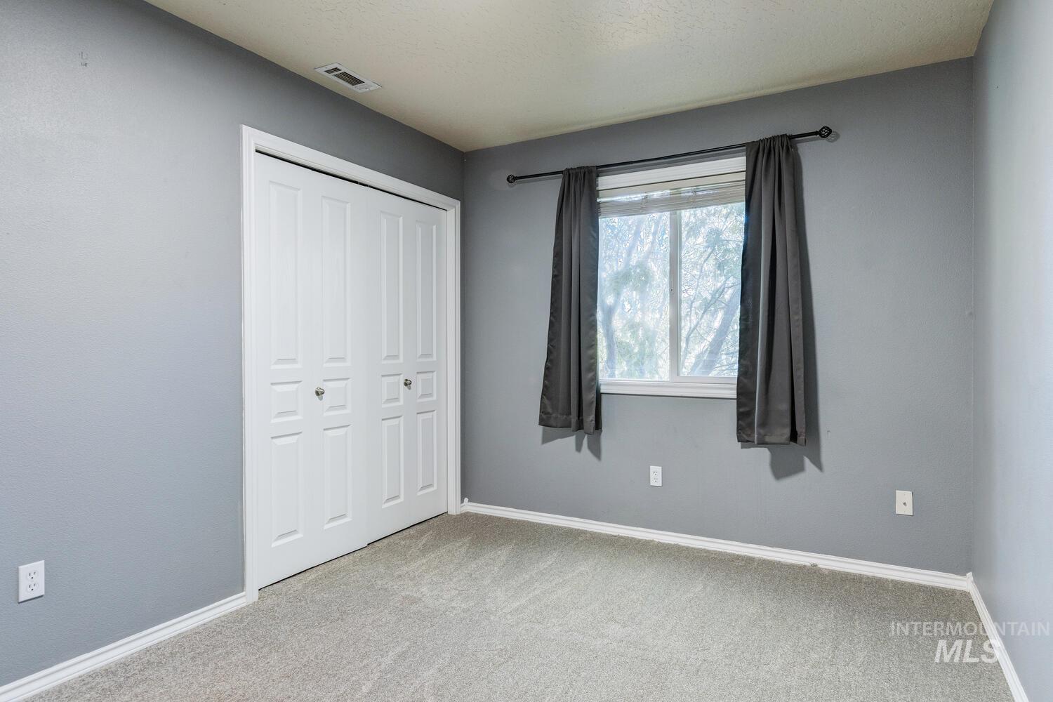4428 West Campfire Street Meridian, ID 83646 - Photo 36 of 46 Unfurnished bedroom with carpet flooring and a closet
