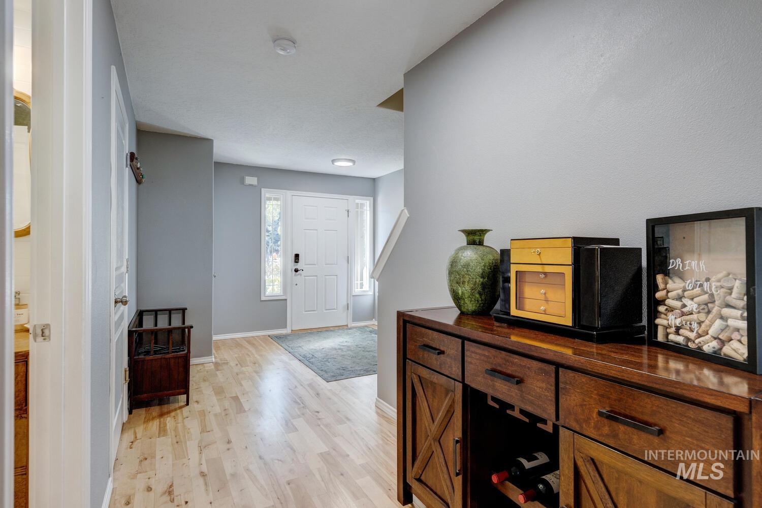 4428 West Campfire Street Meridian, ID 83646 - Photo 5 of 46 Entryway with light wood-type flooring and baseboards