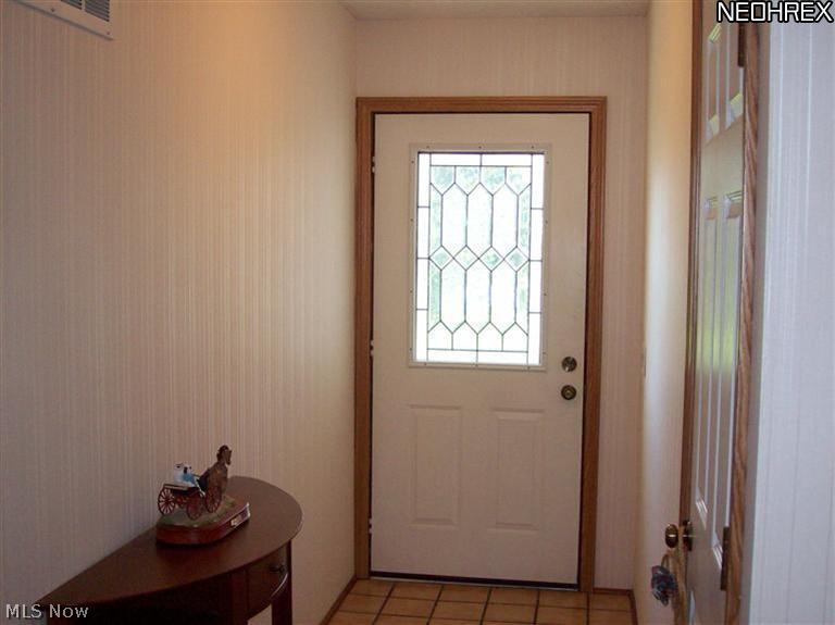 7555 Stone Road Medina, OH 44256 - Photo 3 of 25 A view of the foyer has ceramic and newer hardwood flooring.