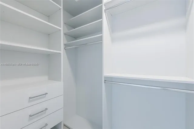 a view of an empty walk in closet