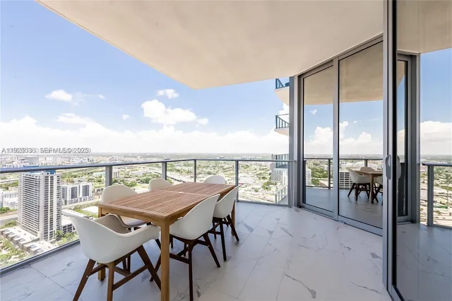 a view of a balcony with furniture