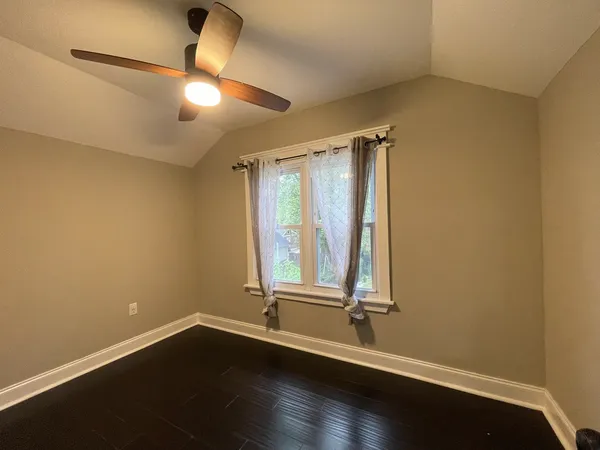 wooden floor and window in an empty room