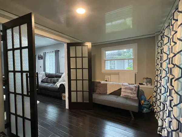 a bedroom with furniture and a window