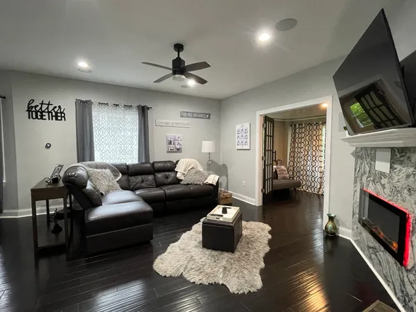 a living room with furniture and a fireplace