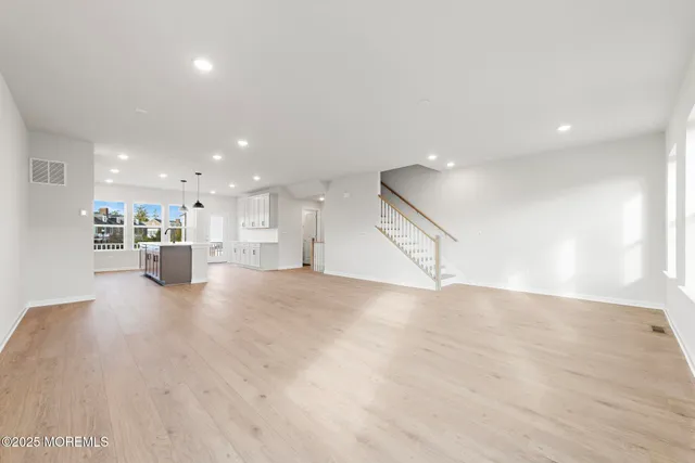 a view of a kitchen with a refrigerator and a counter top space