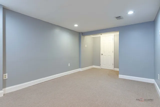 a view of a bathroom with a shower and a sink