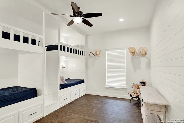 a bedroom with furniture and a window