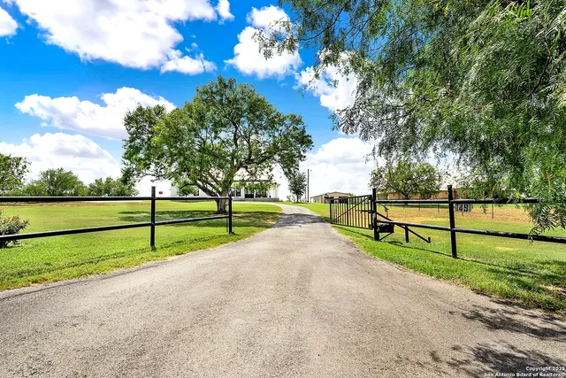 a view of park with wooden fence