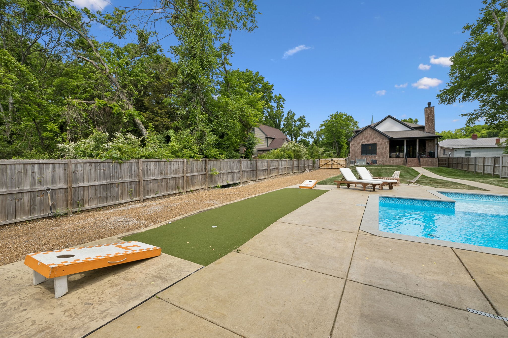 905 West 7th Street Columbia, TN 38401 - Photo 85 of 94 a view of swimming pool with seating area and trees in the background