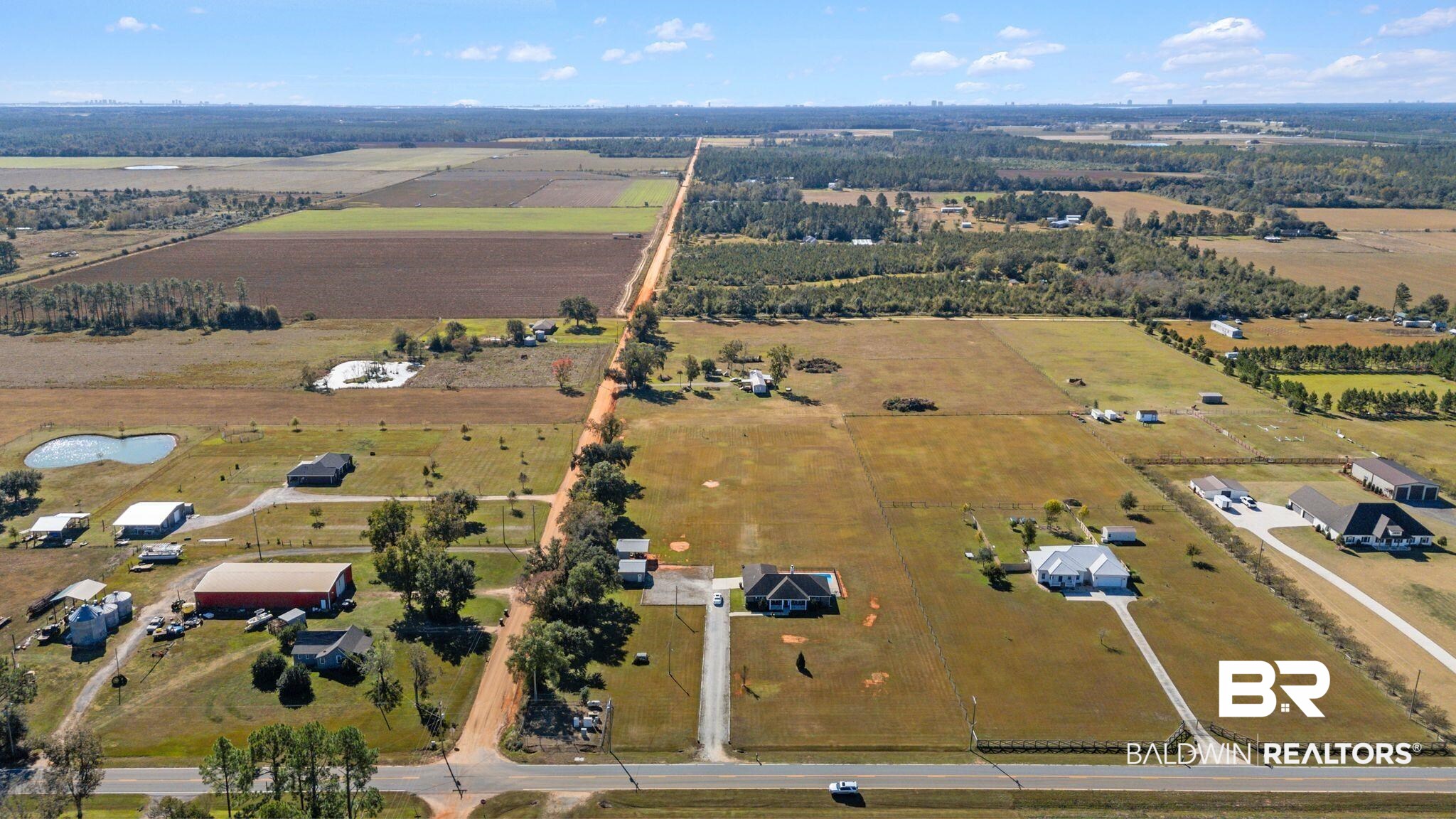 28980 Comstock Road Elberta, AL 36530 - Photo 33 of 38 Aerial view of property and surrounding area with rural landscape