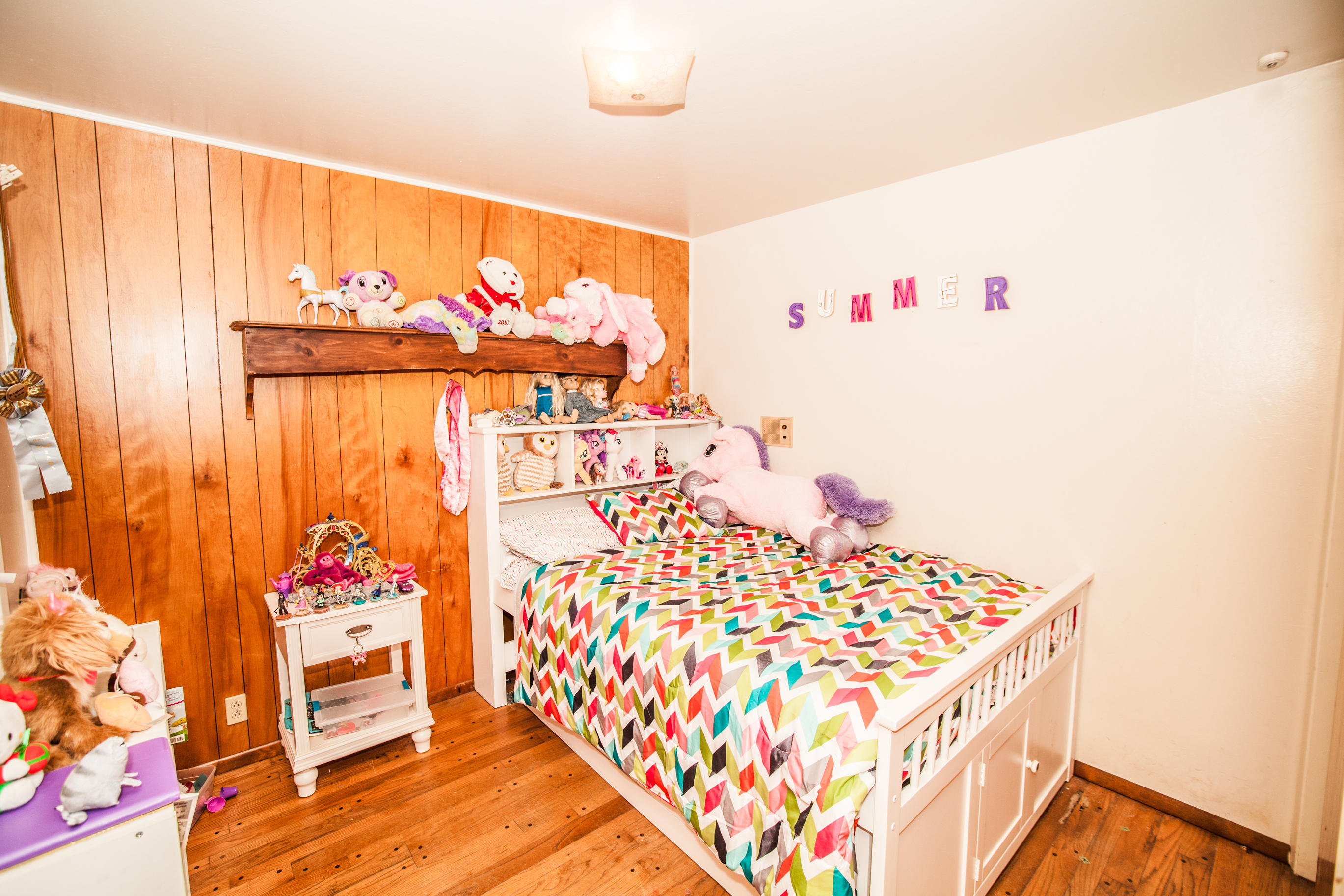 3684 Drybread Road Cottonwood, CA 96022 - Photo 28 of 30 a bedroom with a bed and a chandelier