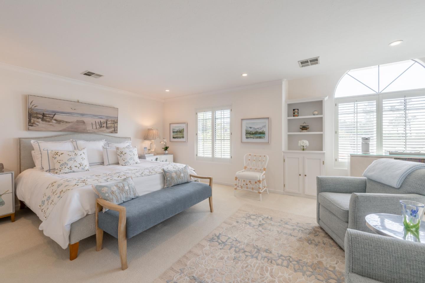 1043 Broncho Road Pebble Beach, CA 93953 - Photo 15 of 21 a spacious bedroom with a bed and glass windows