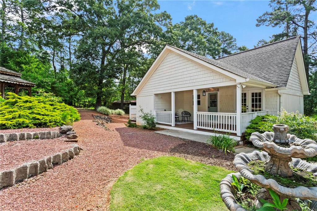 2630 Old Atlanta Road Cumming, GA 30041 - Photo 3 of 87 a view of a house with yard and a garden