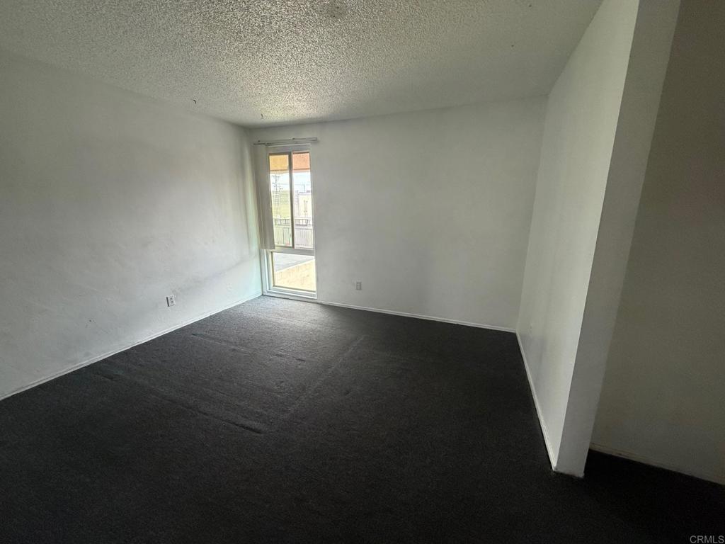 525 Shady Lane, Unit D El Cajon, CA 92021 - Photo 14 of 41 an empty room with windows