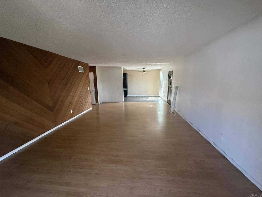 525 Shady Lane, Unit D El Cajon, CA 92021 - Photo 24 of 41 a view of empty room with wooden floor