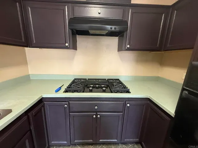 a kitchen with a sink and cabinets