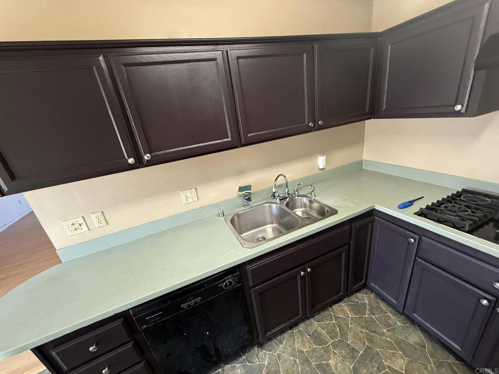 525 Shady Lane, Unit D El Cajon, CA 92021 - Photo 26 of 41 a kitchen with a sink and cabinets