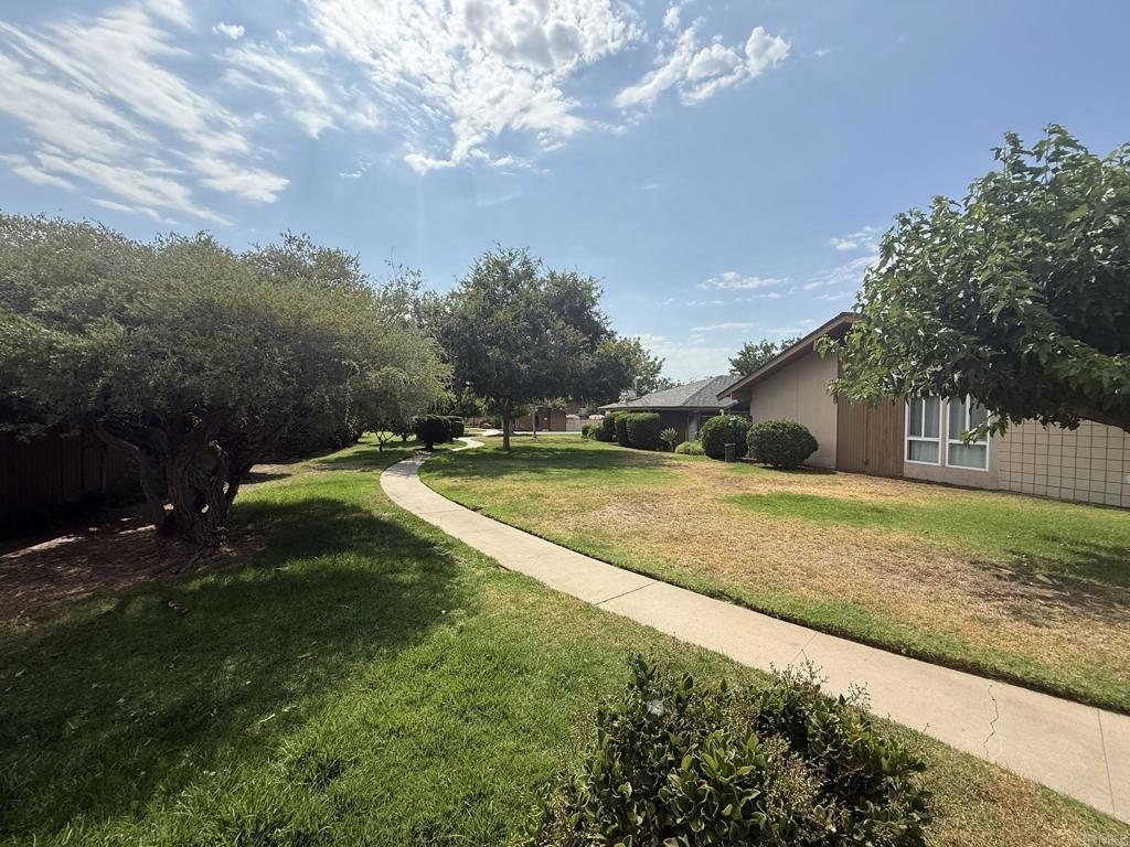525 Shady Lane, Unit D El Cajon, CA 92021 - Photo 30 of 41 a view of a house with a yard