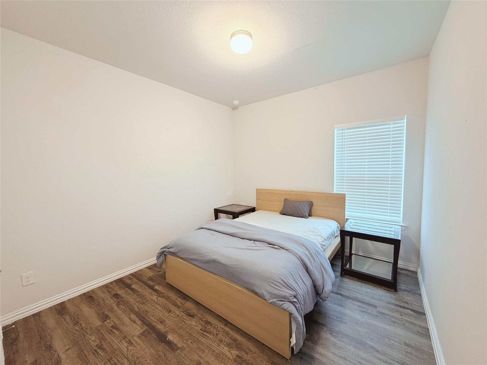 870 5102nd Road Cleveland, TX 77327 - Photo 14 of 27 a bedroom with a bed and a night stand