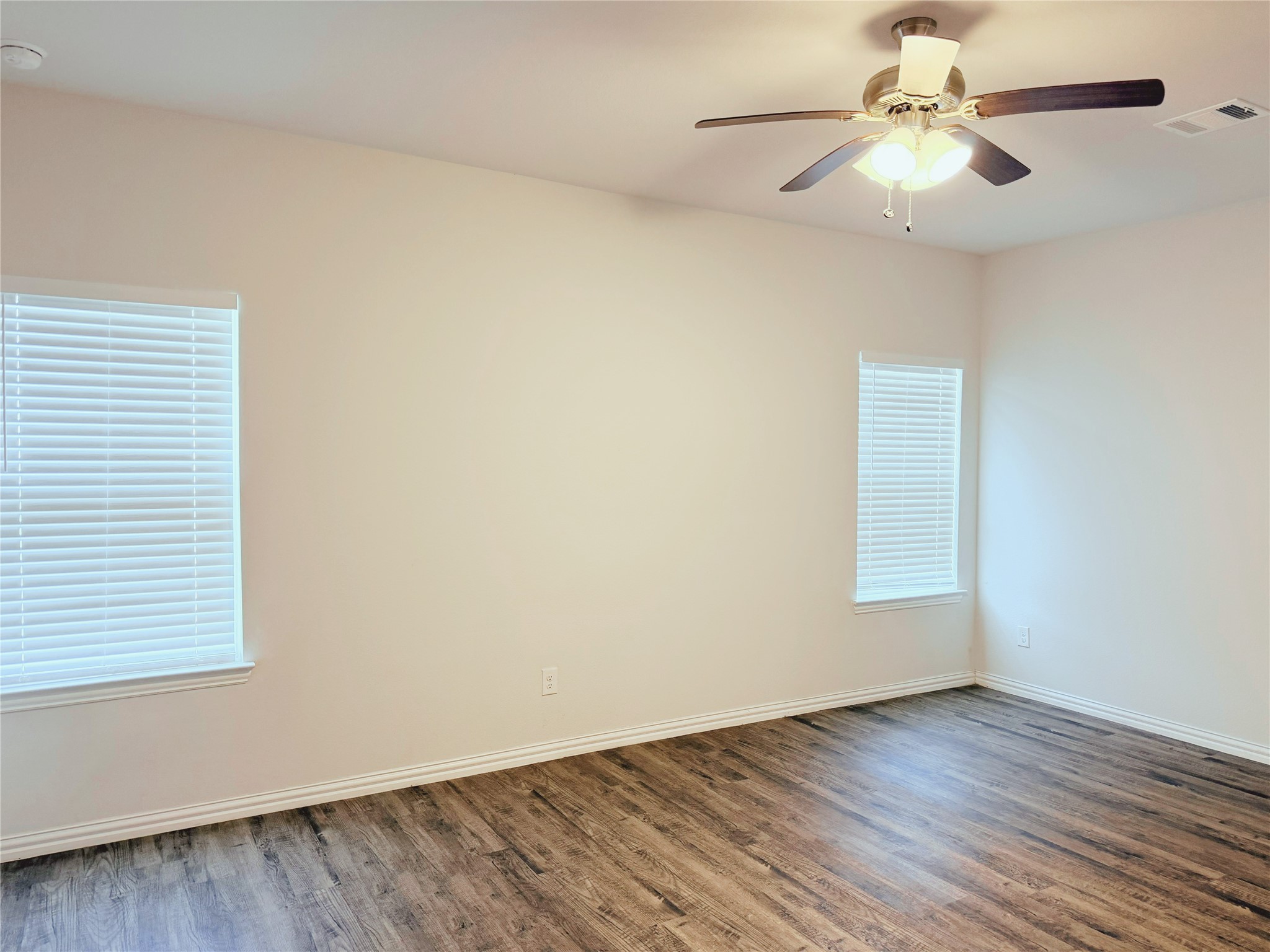 870 5102nd Road Cleveland, TX 77327 - Photo 16 of 27 wooden floor in an empty room with a window