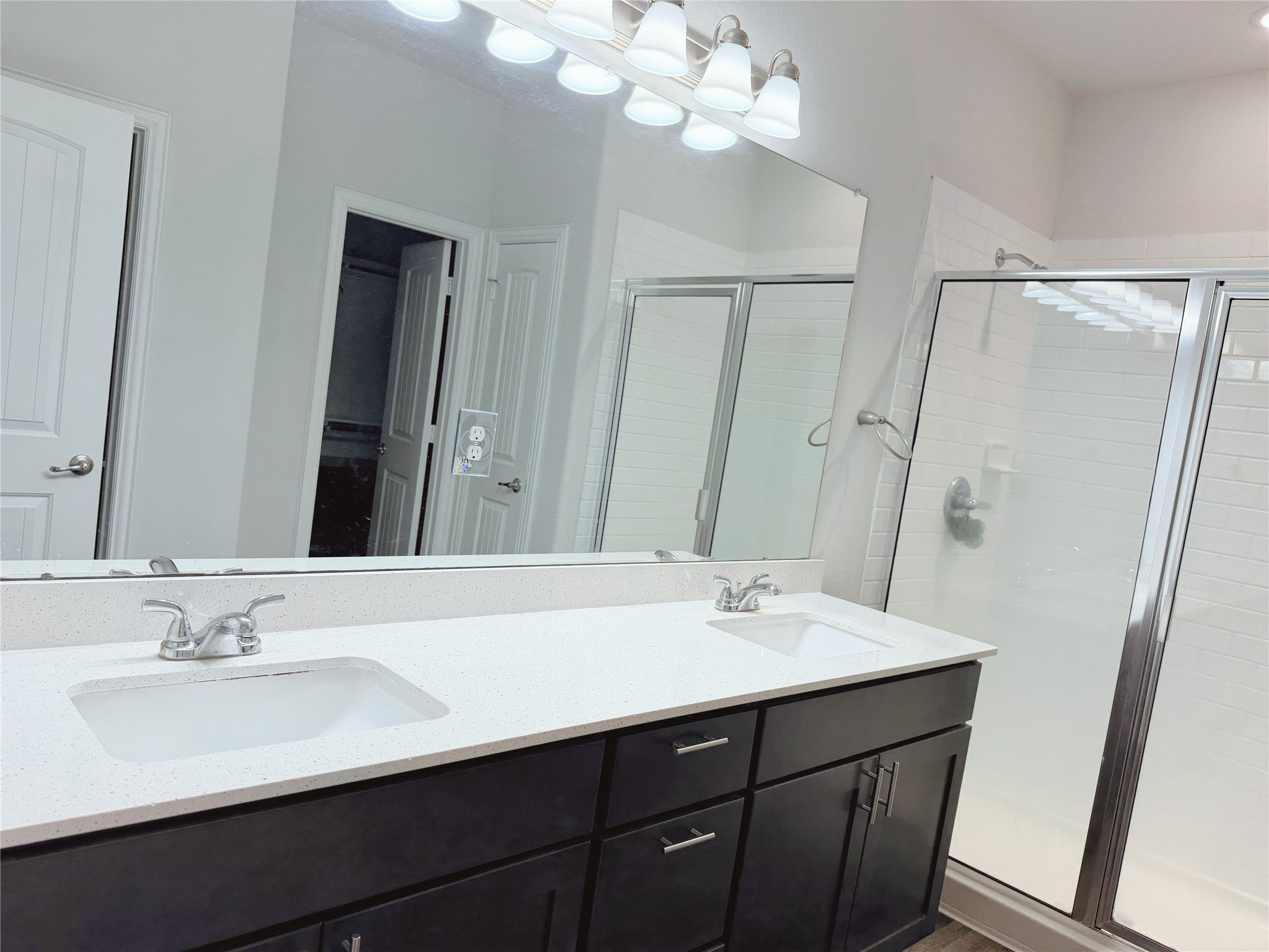 870 5102nd Road Cleveland, TX 77327 - Photo 20 of 27 a bathroom with a sink double vanity and a mirror