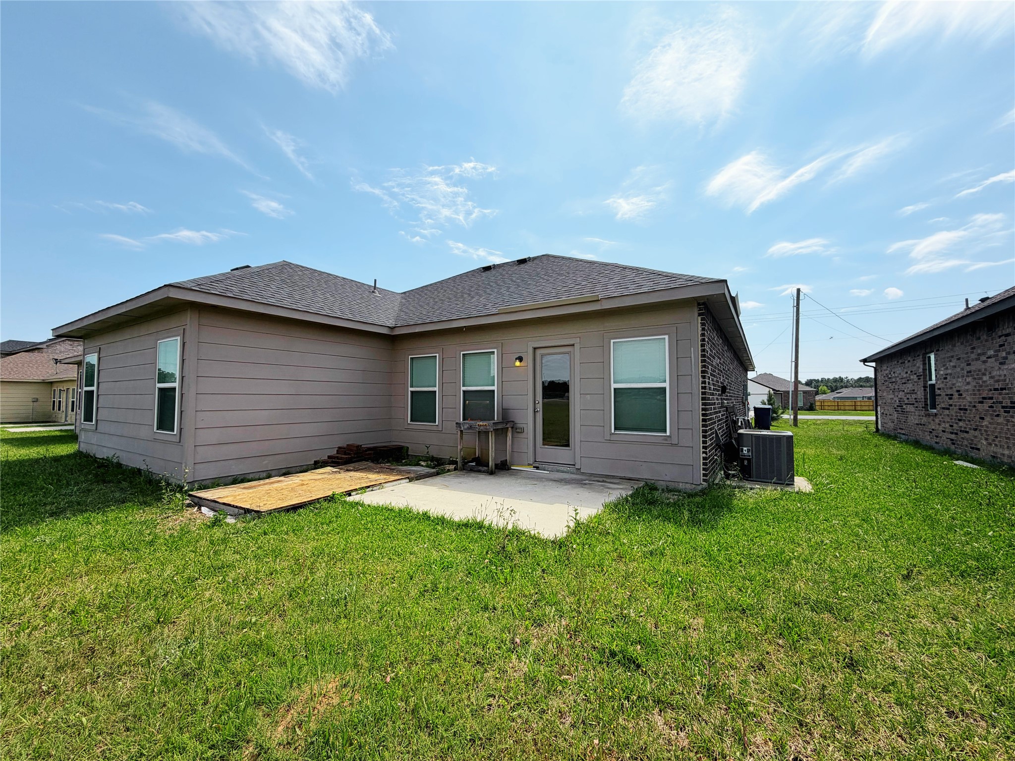 870 5102nd Road Cleveland, TX 77327 - Photo 26 of 27 a backyard of a house with table and chairs