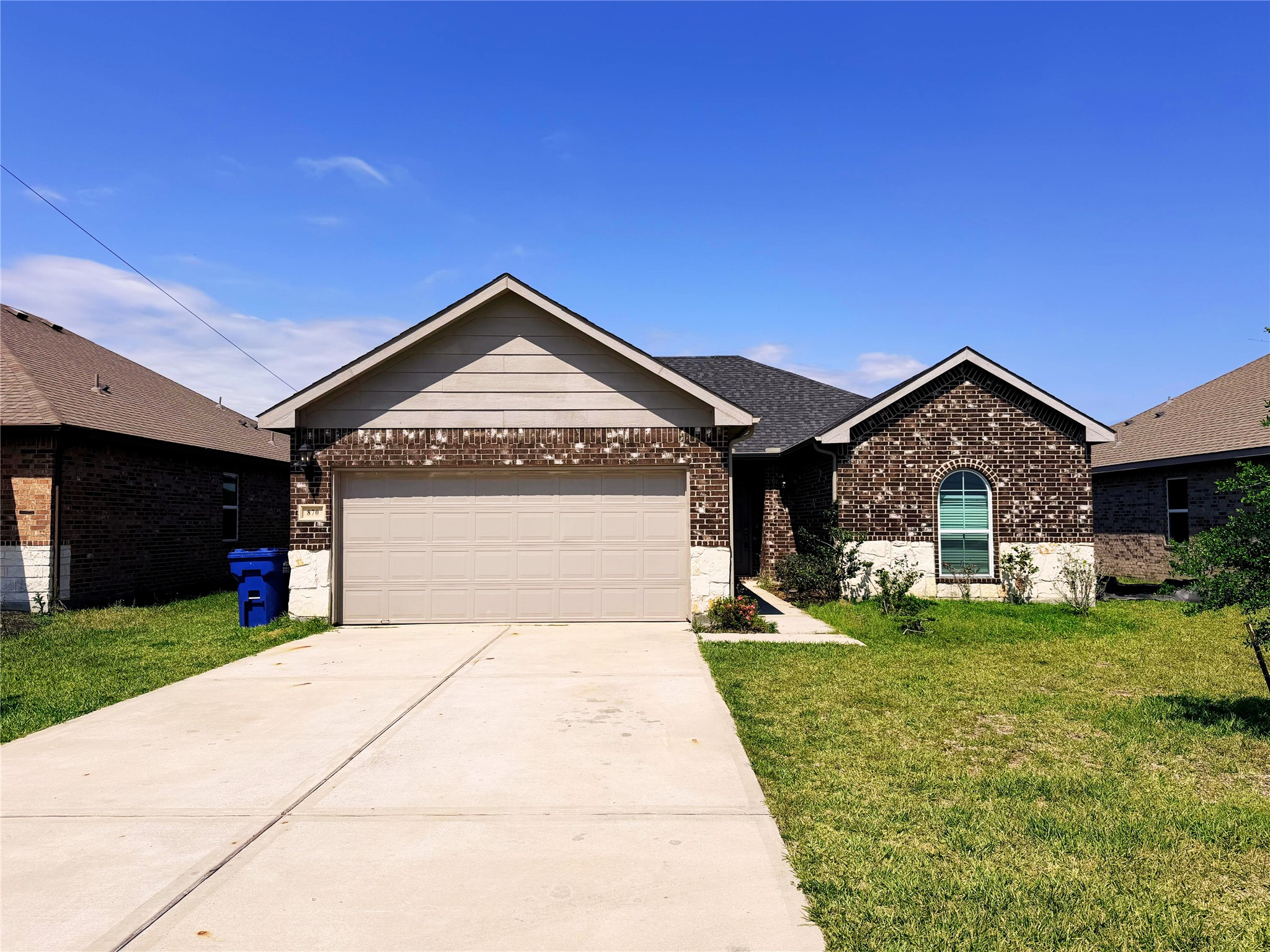 870 5102nd Road Cleveland, TX 77327 - Photo 27 of 27 a front view of a house with a yard and garage