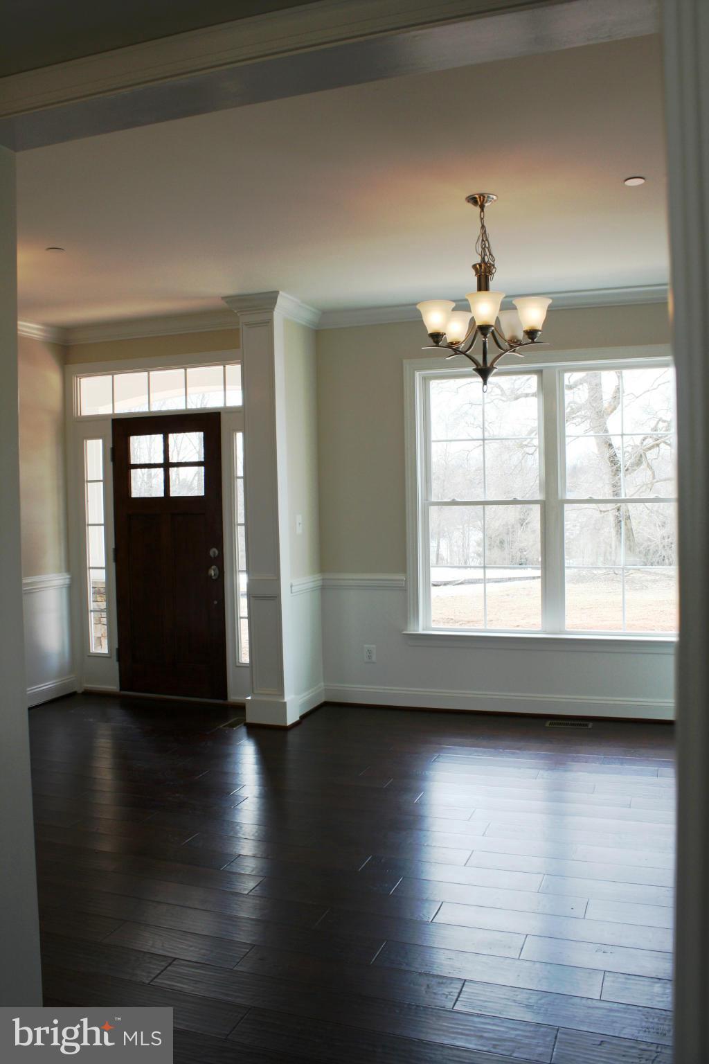 1735 Laurel Brook Road Fallston, MD 21047 - Photo 4 of 20 an empty room with wooden floor and windows