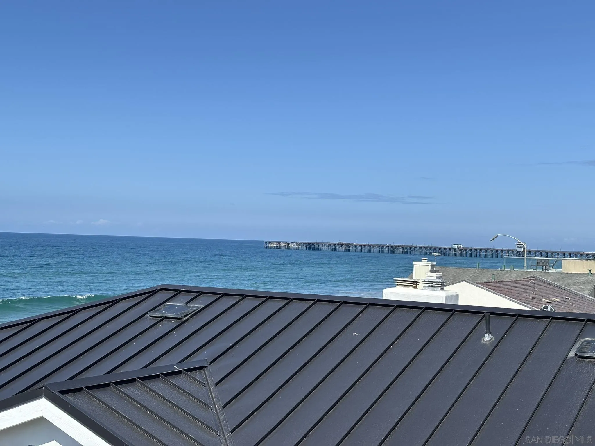 514 South The Strand, Unit D Oceanside, CA 92054 - Photo 18 of 18 a view of an ocean from a balcony