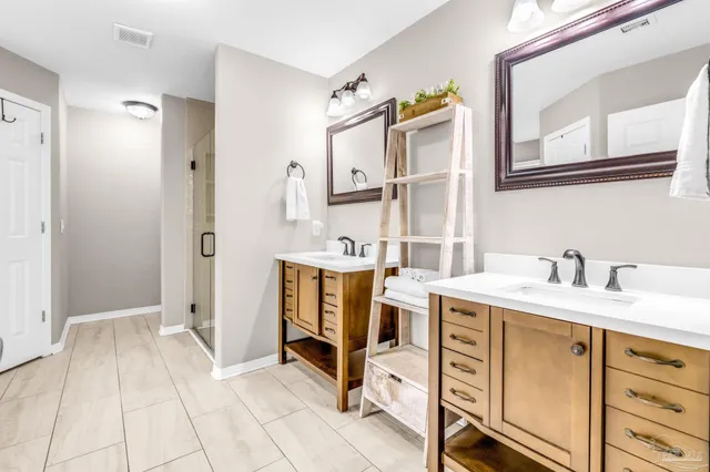 a view of a bathroom with a sink and a mirror