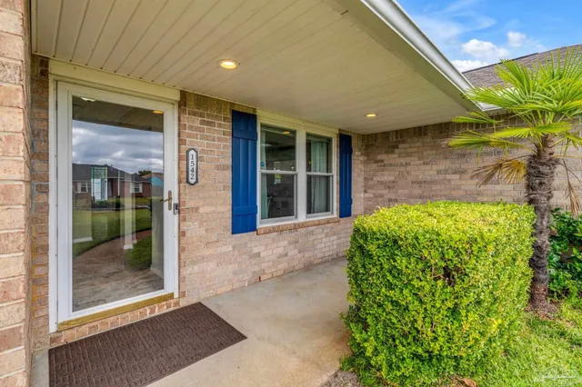 a front view of a house with a large window